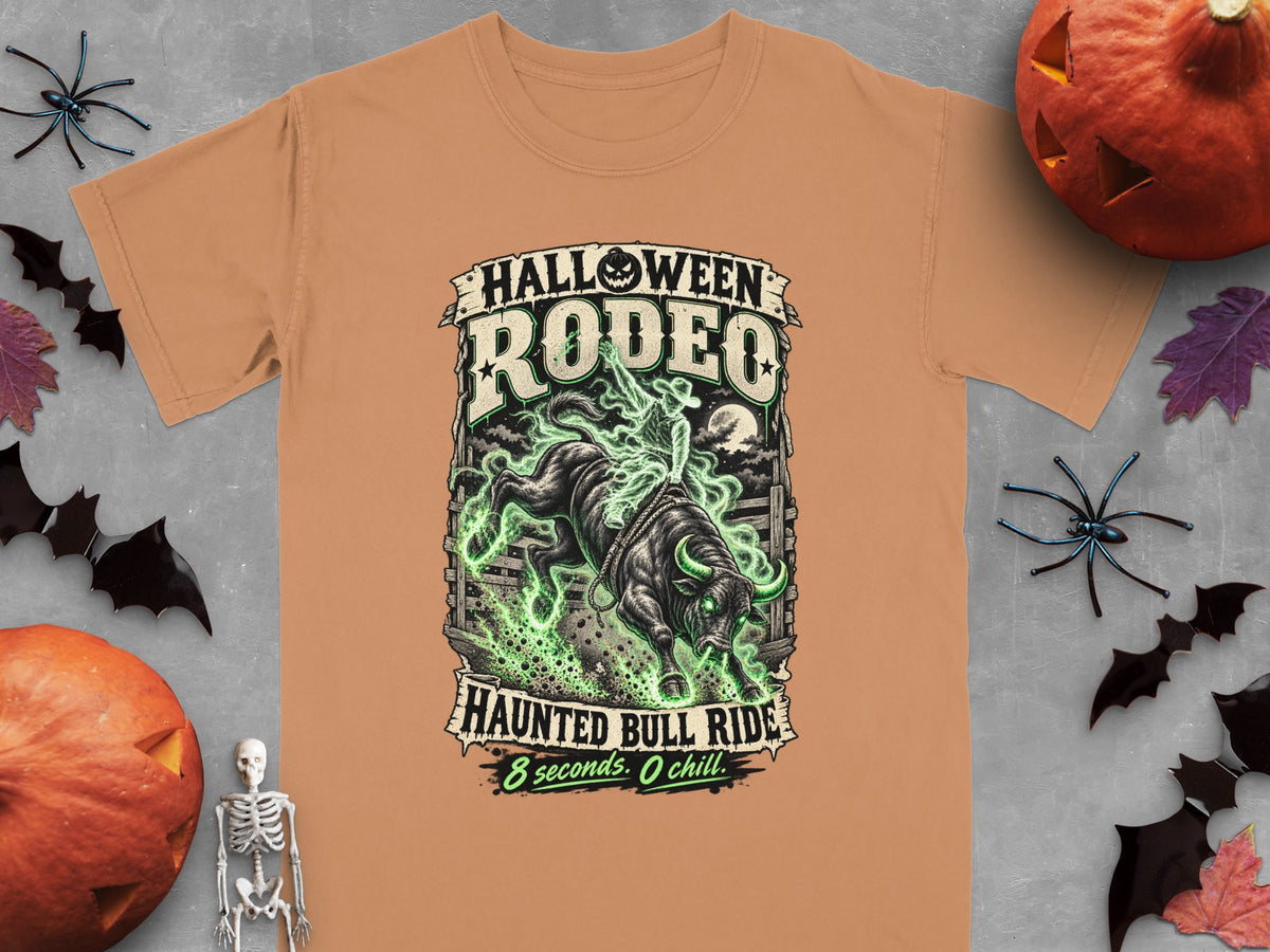T-shirt with "Halloween Rodeo Haunted Bull Ride" text and a bull with green flames.