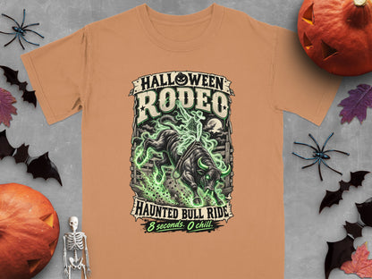 T-shirt with "Halloween Rodeo Haunted Bull Ride" text and a bull with green flames.
