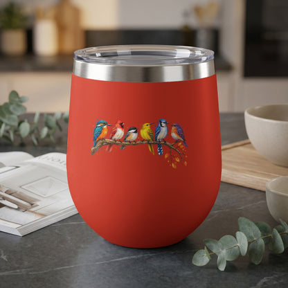 Red tumbler with a painted design of six colorful birds perched on a branch.