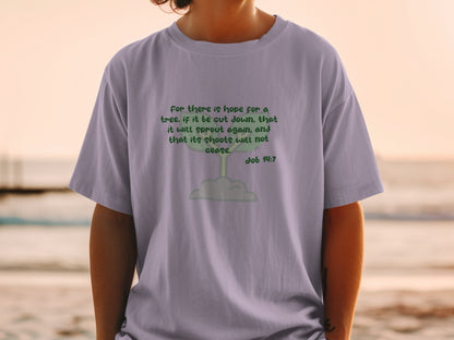 Light purple t-shirt with text "For there is hope for a tree, if it be cut down, that it will sprout again, and that its shoots will not cease. Job 14:7".