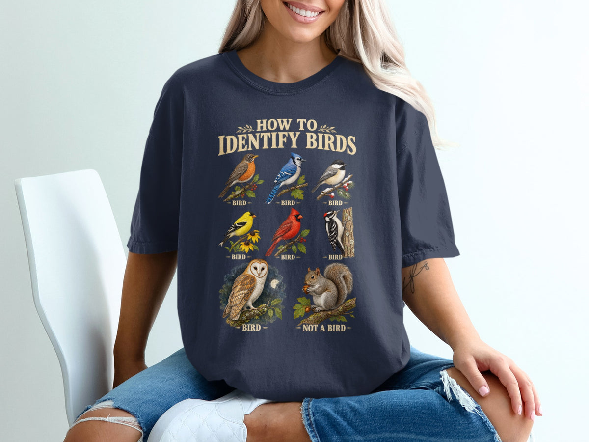 T-shirt graphic with "How to Identify Birds" text and illustrations of various birds and a squirrel.