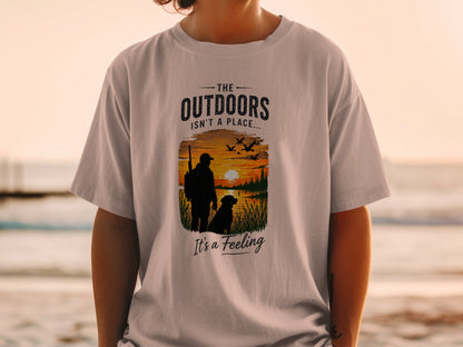 T-shirt with "The Outdoors Isn't a Place It's a Feeling" and hunting graphic.