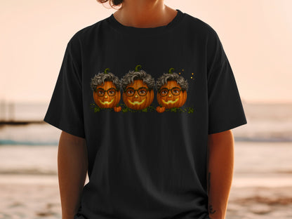 Three pumpkins with glasses and curly gray hair, printed on a black t-shirt.