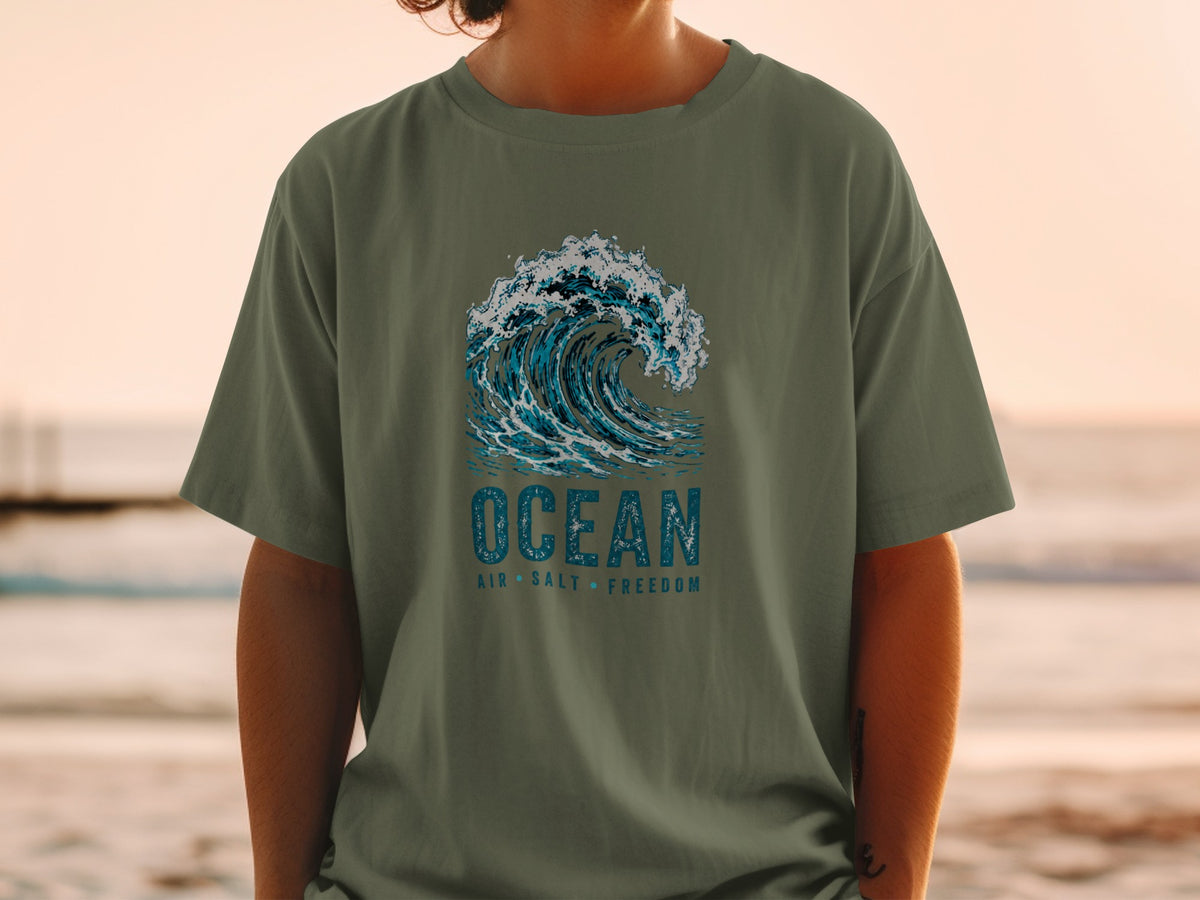 Olive t-shirt with a distressed graphic of a breaking ocean wave and text.