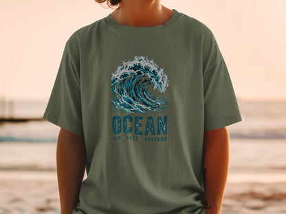 Olive t-shirt with a distressed graphic of a breaking ocean wave and text.