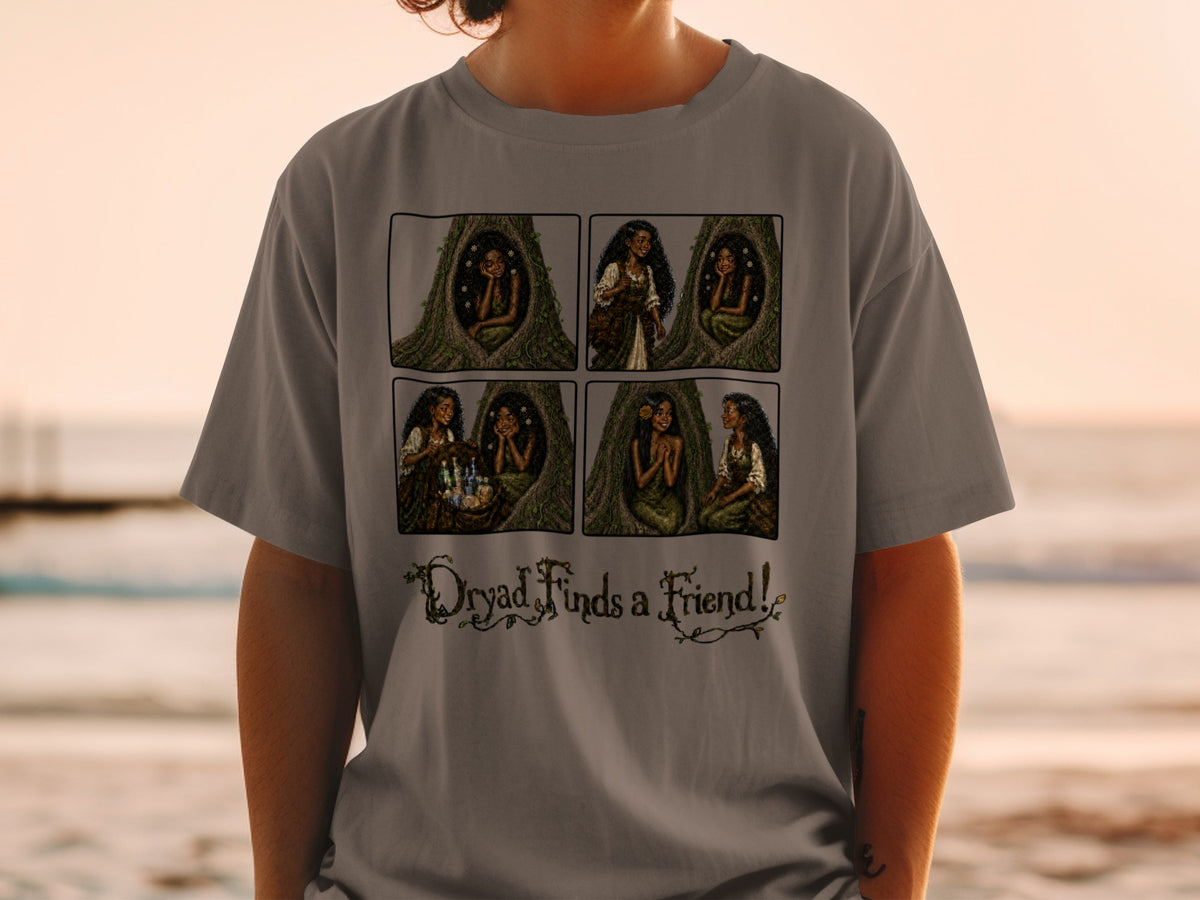 Comic strip on grey t-shirt shows a dryad with friends and text "Dryad Finds a Friend!".
