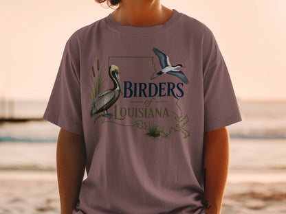 Birders of Louisiana t-shirt with pelican and flying bird graphic.