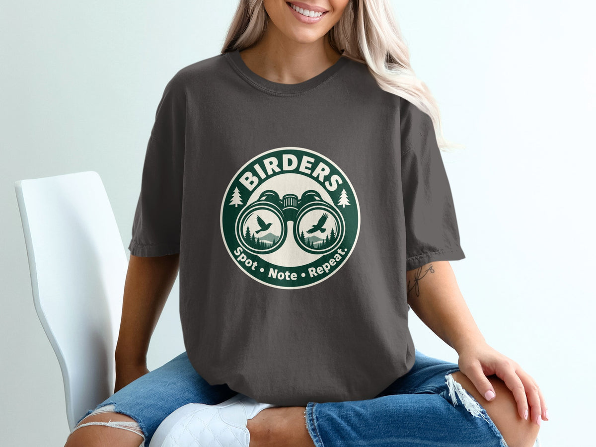 Dark grey t-shirt with "Birders Spot Note Repeat" logo featuring binoculars and birds.