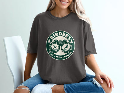 Dark grey t-shirt with "Birders Spot Note Repeat" logo featuring binoculars and birds.