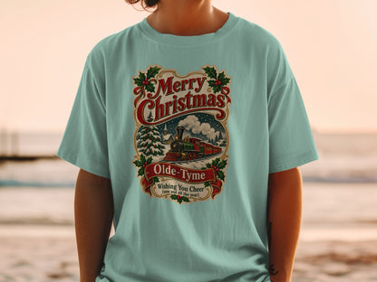 Light blue t-shirt with vintage Christmas train graphic and text.