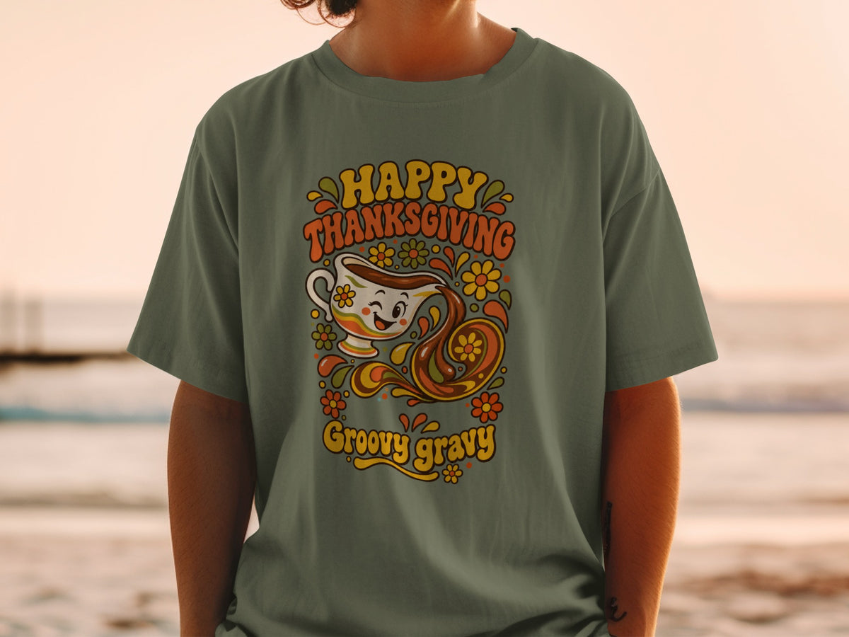 Green t-shirt with "Happy Thanksgiving Groovy Gravy" text and gravy boat graphic.