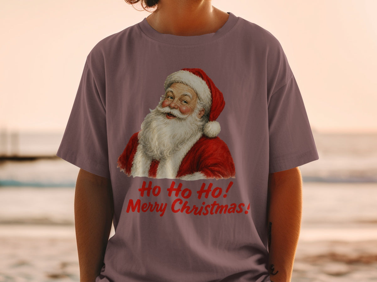 Santa Claus graphic with "Ho Ho Ho! Merry Christmas!" text on a purple t-shirt.