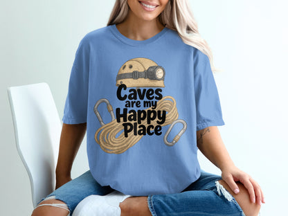 Blue t-shirt with cave helmet, rope, carabiners, and text "Caves are my Happy Place."