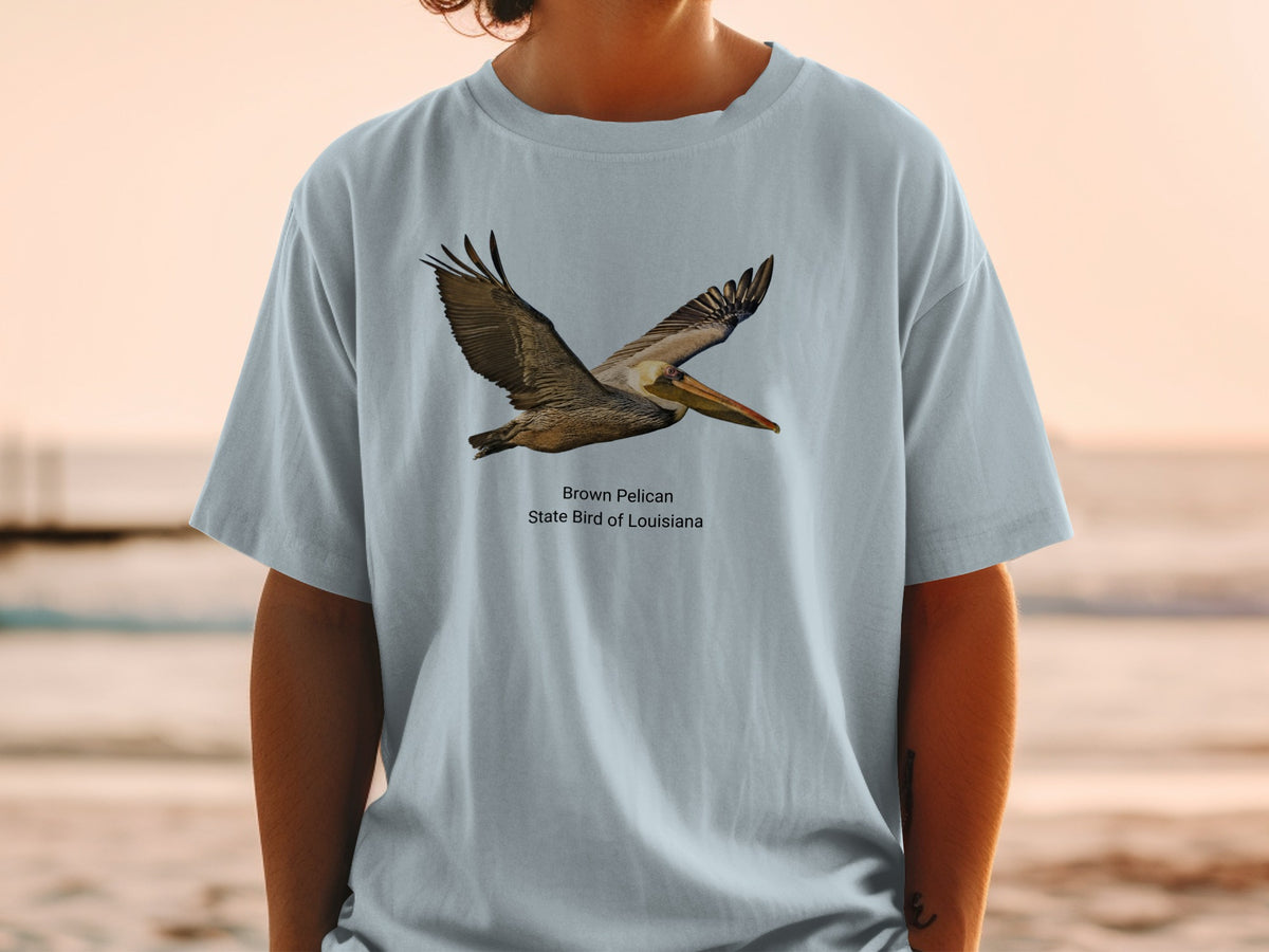 Brown Pelican, State Bird of Louisiana graphic on a light blue t-shirt.