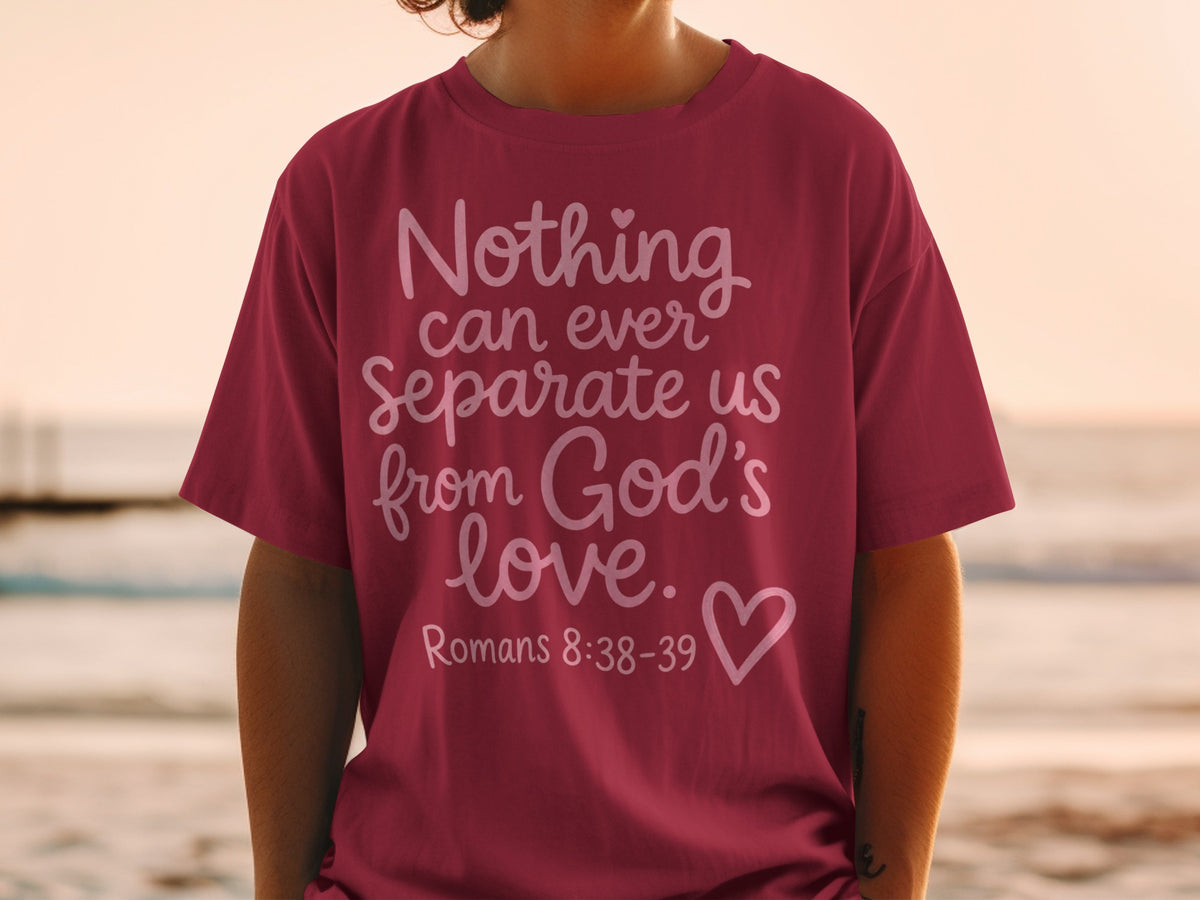 Maroon t-shirt with white text: "Nothing can ever Separate us from God's love." Romans 8:38-39.