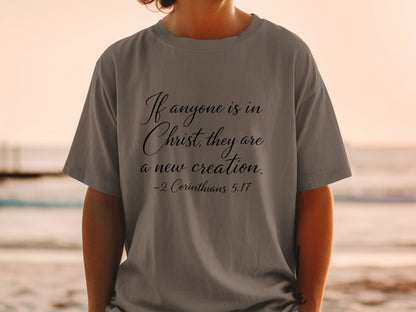 Grey t-shirt with "If anyone is in Christ, they are a new creation. -2 Corinthians 5:17"