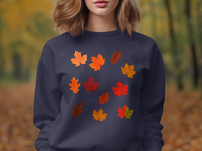 Navy sweatshirt with a pattern of nine autumn leaves in various colors.