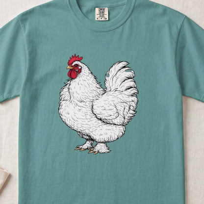 A teal crewneck t-shirt featuring a detailed illustration of a white rooster centered on the chest.