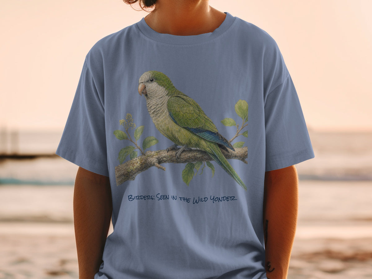 Green parrot perched on a branch with text "BIRDER: SEEN IN THE WILD YONDER".