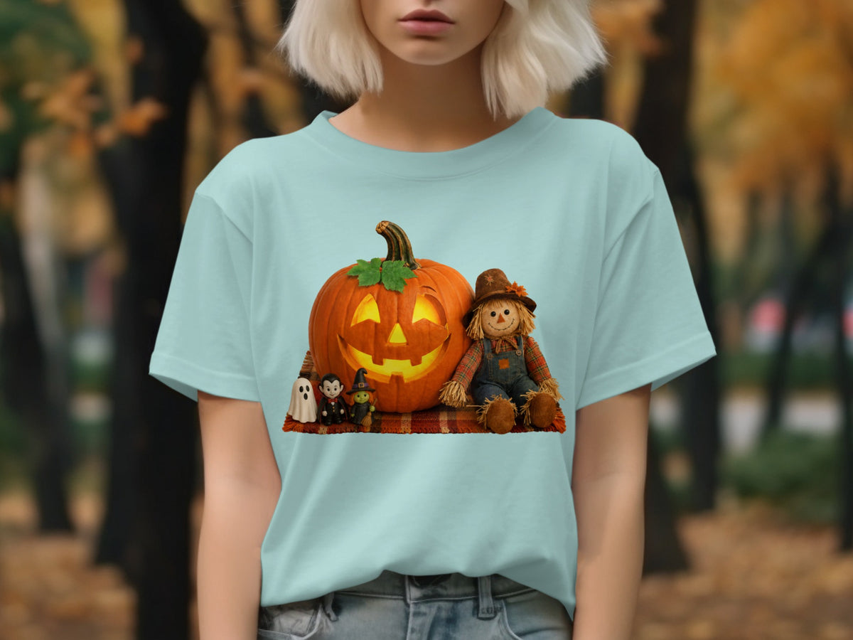 Light blue t-shirt with a Halloween graphic of a scarecrow, pumpkin, and spooky figures.