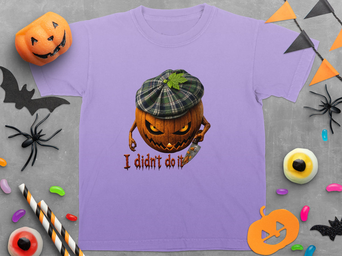 Purple t-shirt with a grinning jack-o'-lantern wearing a plaid cap holding a knife and text "I didn't do it".