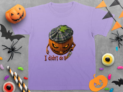 Purple t-shirt with a grinning jack-o'-lantern wearing a plaid cap holding a knife and text "I didn't do it".