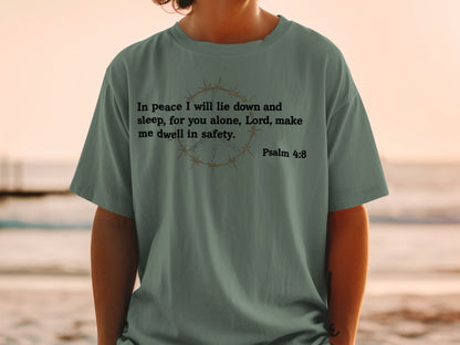 T-shirt with "In peace I will lie down and sleep, for you alone, Lord, make me dwell in safety. Psalm 4:8" text.
