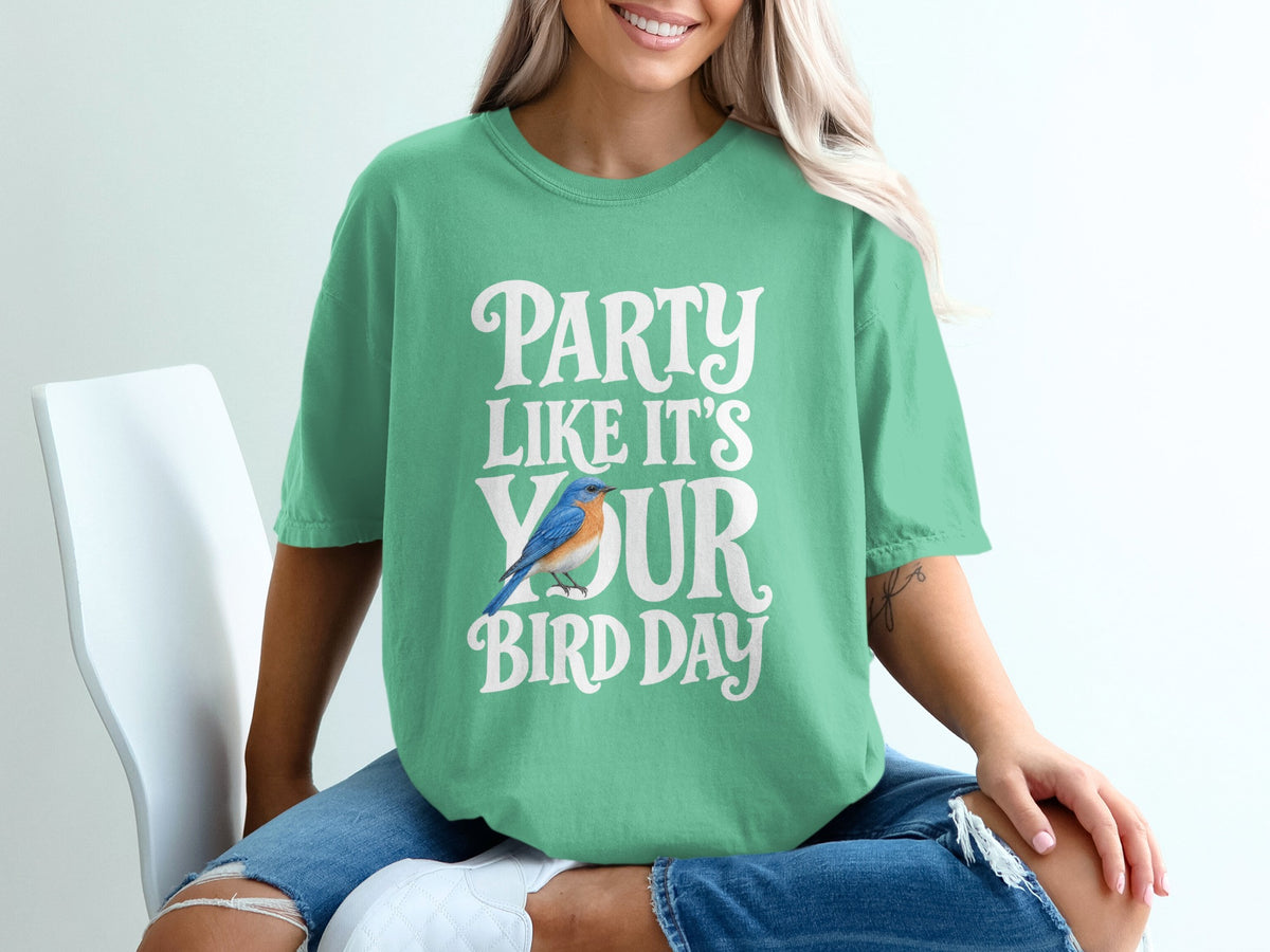 Green t-shirt with white text "PARTY LIKE IT'S YOUR BIRD DAY" and a bluebird graphic.