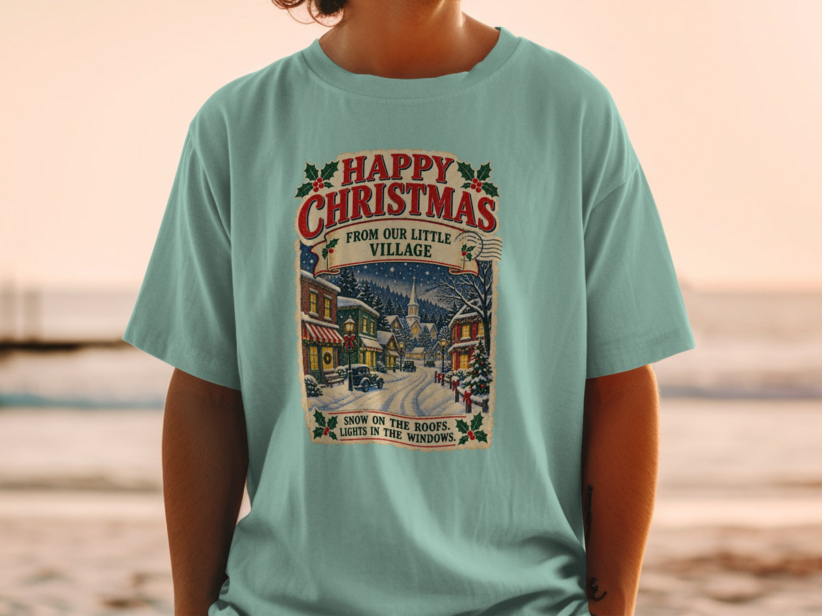 Happy Christmas from Our Little Village with snow scene and text.