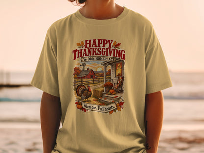 Thanksgiving t-shirt graphic with farm scene, turkey, and text: "Happy Thanksgiving Ye Olde Homeplace Warm pie. Full hearts."