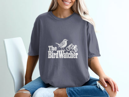 Gray t-shirt with white text and graphic of a bird and binoculars.