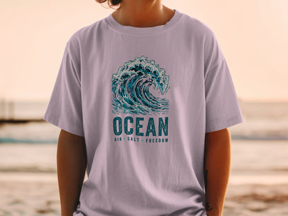 T-shirt with a crashing wave graphic and "Ocean Air Salt Freedom" text.