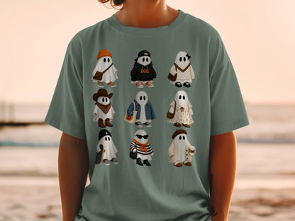 Nine cute cartoon ghosts dressed in various fashionable outfits on a t-shirt.