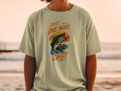 T-shirt graphic with jumping bass, sun, and text "JUST ONE MORE CAST."