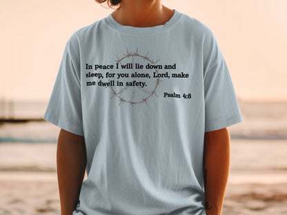Light blue t-shirt with "In peace I will lie down and sleep, for you alone, Lord, make me dwell in safety. Psalm 4:8" text.