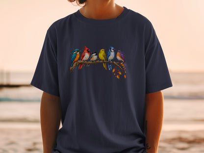 Six colorful birds perch on a branch with autumn leaves on a dark t-shirt.