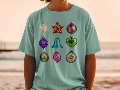T-shirt with a grid of nine colorful Christmas ornaments.
