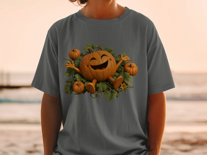 T-shirt featuring a cartoon pumpkin with outstretched arms surrounded by vines and smaller pumpkins.