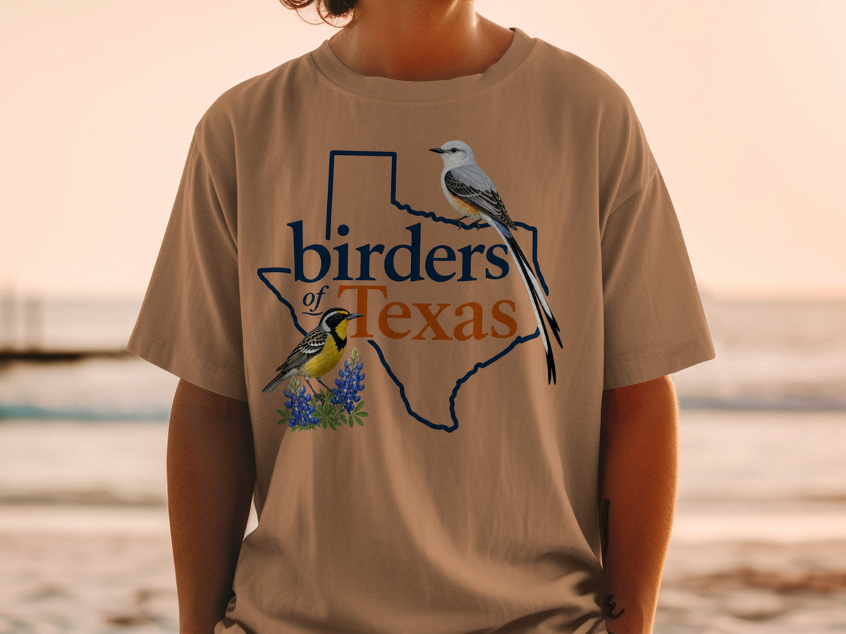 Birders of Texas graphic on a tan t-shirt with two birds and bluebonnets.