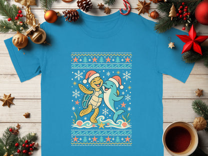 Blue t-shirt with a Christmas-themed sea turtle and dolphin graphic.