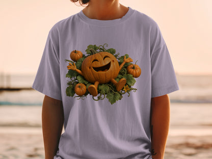 T-shirt with graphic of a happy pumpkin surrounded by leaves and smaller pumpkins.