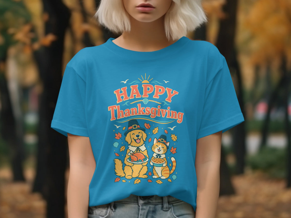 Blue t-shirt with "Happy Thanksgiving" text, a dog holding a turkey, and a cat holding a pie.