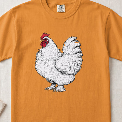 An orange crewneck t-shirt featuring an illustration of a detailed white rooster centered on the chest.