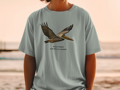 Brown Pelican State Bird of Louisiana graphic on light gray t-shirt.