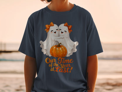 Two cartoon ghosts hug over a pumpkin, with text "Our Time of the Year, at Last!".