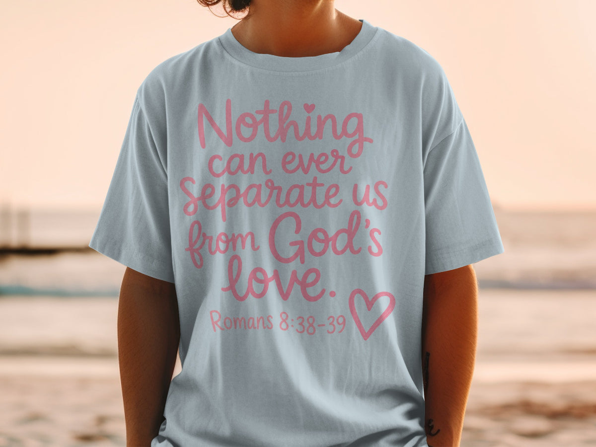 Light blue t-shirt with pink text "Nothing can ever separate us from God's love. Romans 8:38-39".