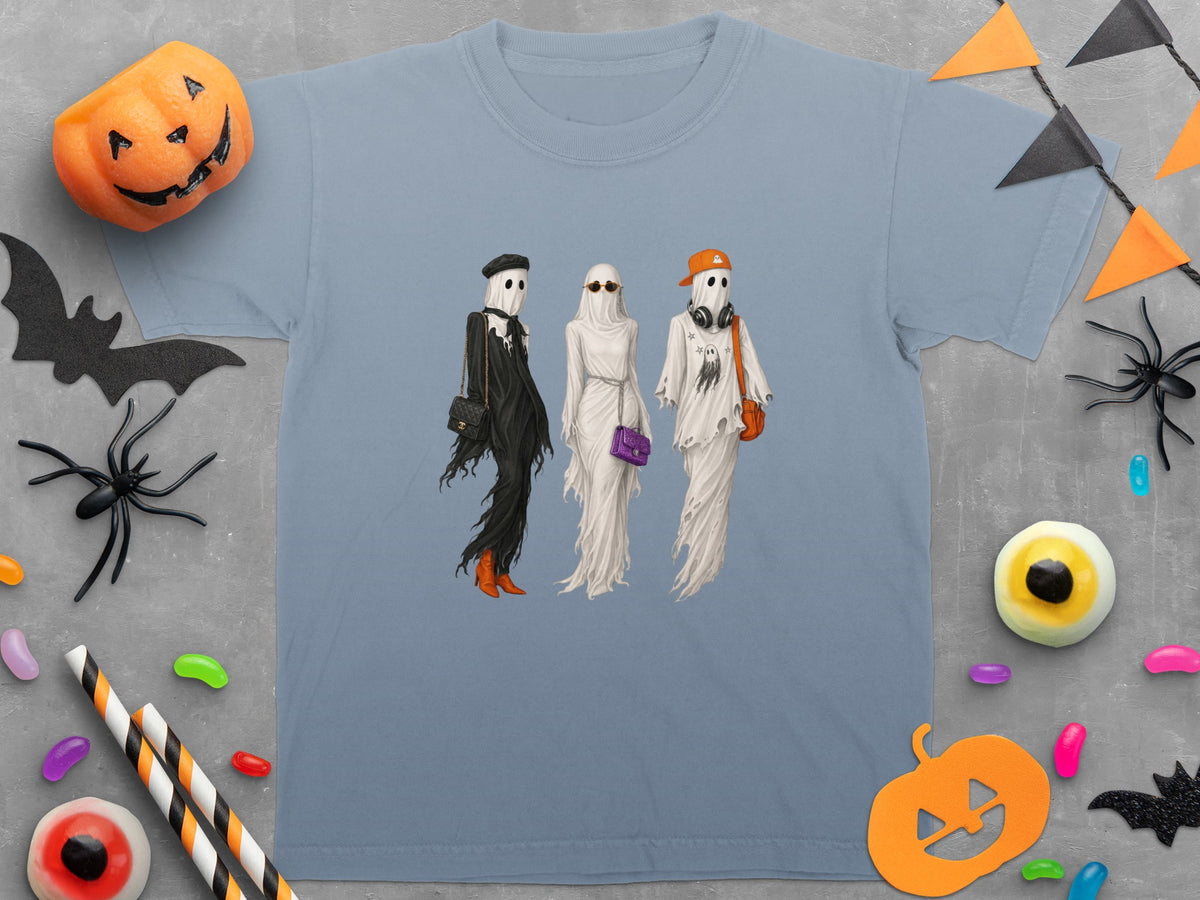T-shirt with graphic of three fashionable ghosts, Halloween decorations.