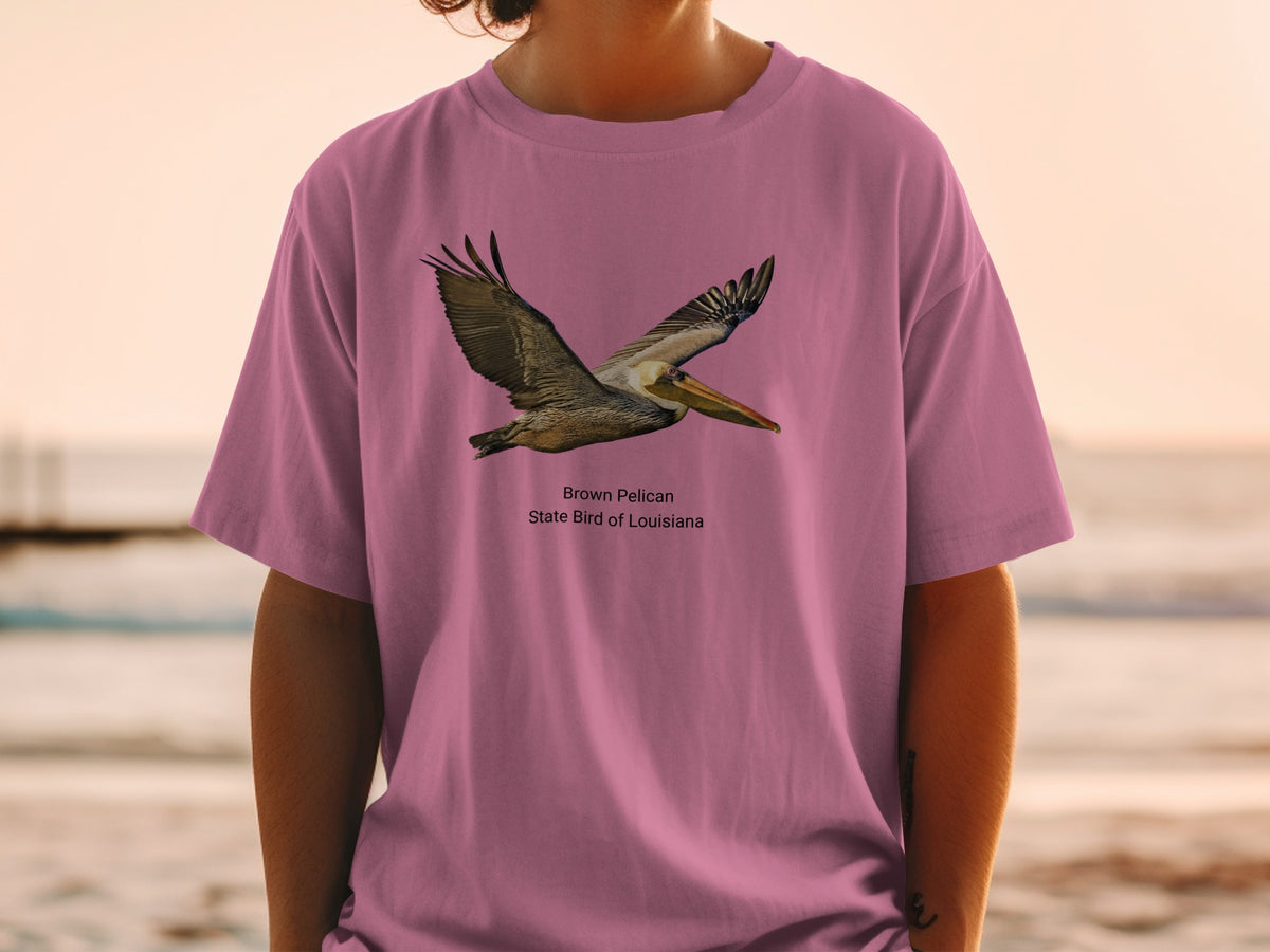 Brown Pelican flying, State Bird of Louisiana text on a pink t-shirt.