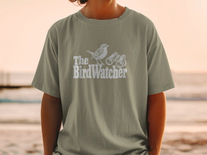 T-shirt with white graphic of bird and binoculars and text "The BirdWatcher".