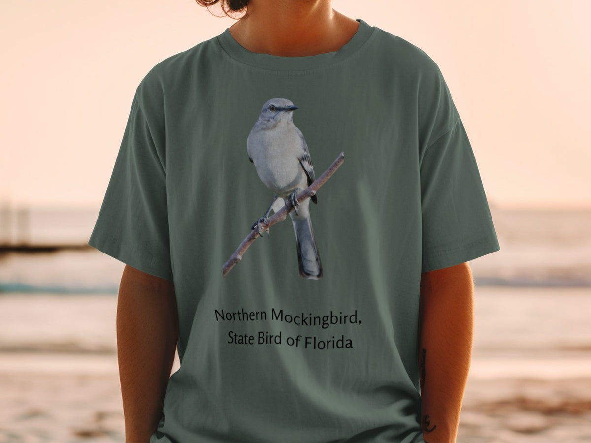Northern Mockingbird, State Bird of Florida design on a green t-shirt.